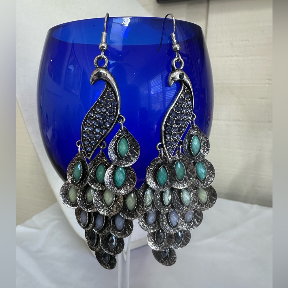 Long matte silvertone peacock earrings
